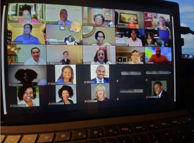 Business owners meeting online in a video call on a laptop