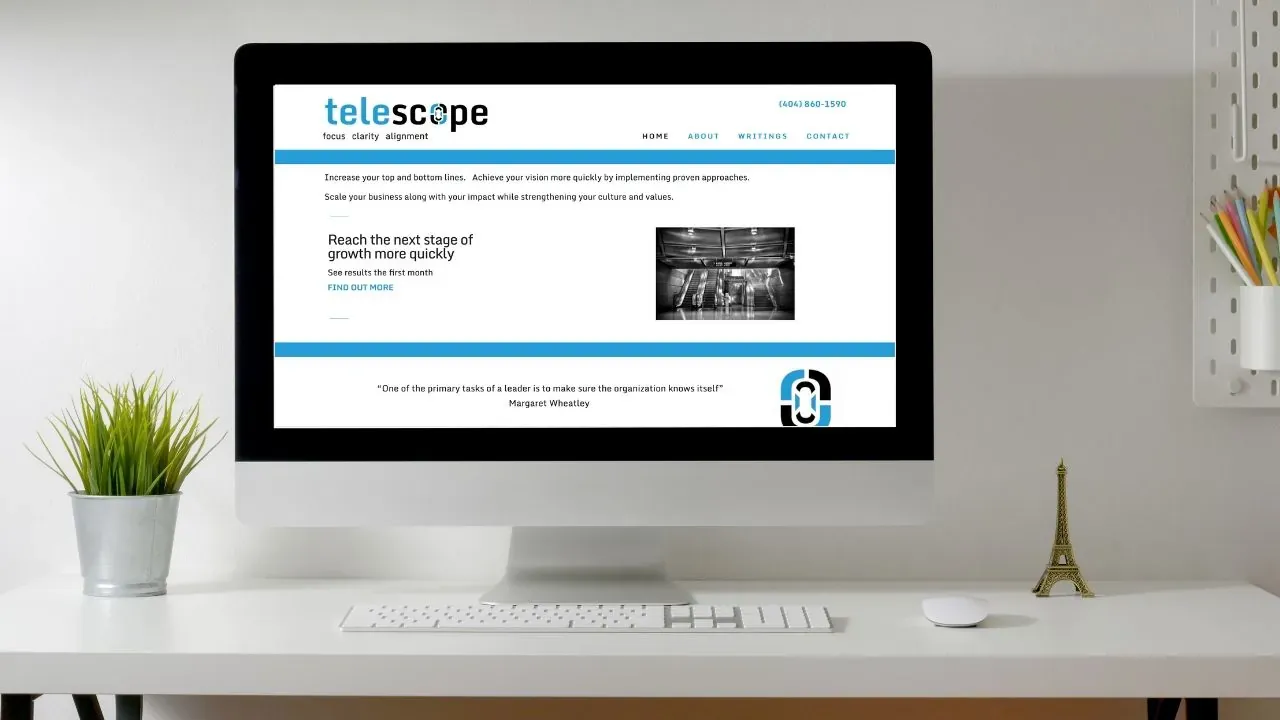 iMac on a desk displaying the Telescope Advisers website