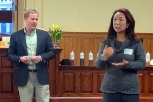 Two presenters speaking at the front of a Rockville Science Center community session